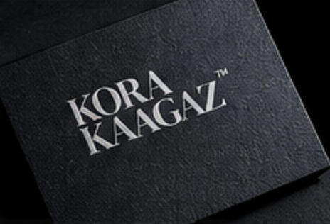 Kora Kaagaz wordmark debossed on black card