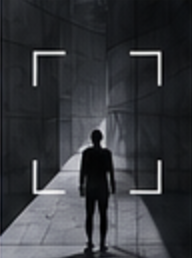 A figure walking through a concrete corridor, framed by the studio's canvas brackets