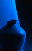 Ceramic vase silhouetted against cobalt